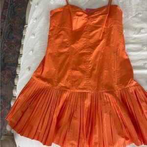 Orange pleated dress from baby in pink